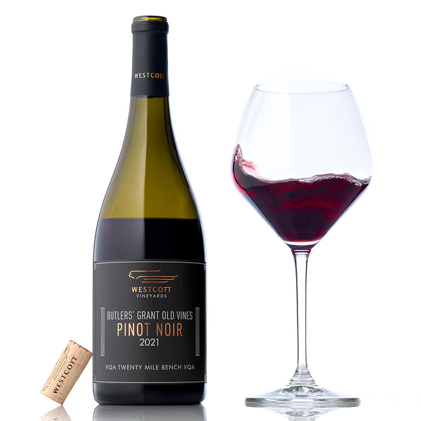 A glass and bottle of Westcott Vineyards' 2021 Butler's Grant Old Vines Pinot Noir.